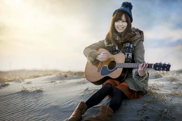 A girl playing the guitar