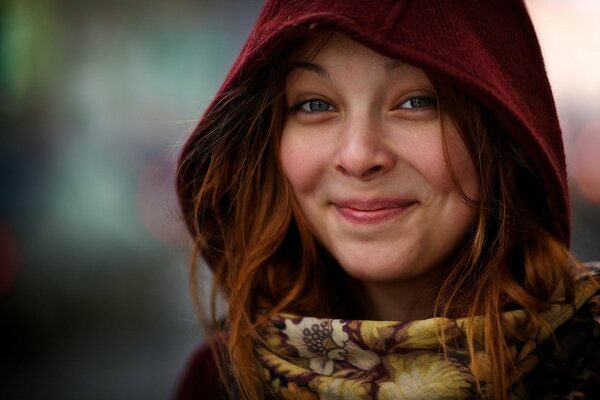 Hooded girl with a smile