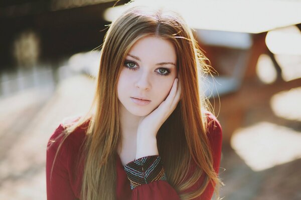 Red-haired girl in red clothes