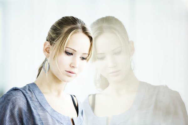 Brooding Jennifer Lawrence and her reflection