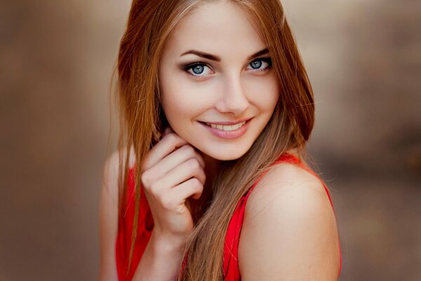 Portrait of a girl with red hair and blue eyes