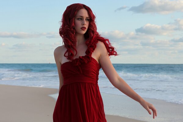 Red-haired girl on the background of the sea