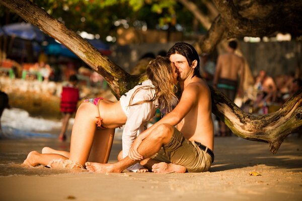 A guy and a girl in love on the beach