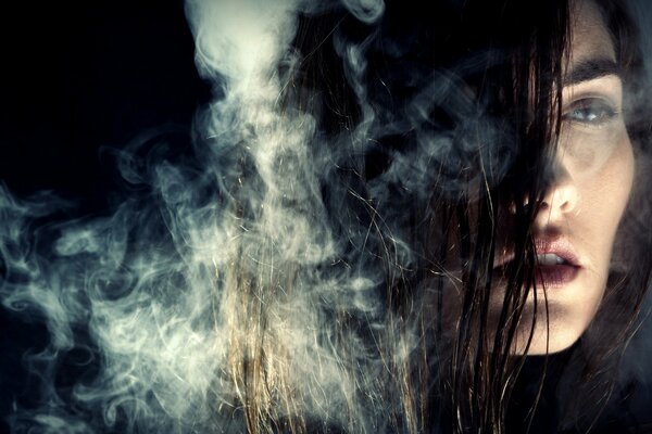 Close-up of a girl in smoke