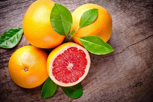 Grapefruit with red filling and green leaves