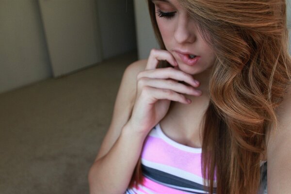 Acacia Clark in a pink striped tank top