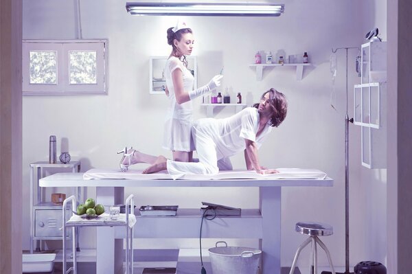 In a hospital room, a doctor with a patient