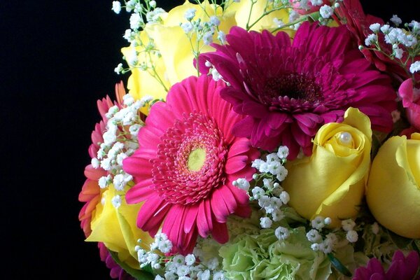 A beautiful bouquet of yellow roses, red gerberas and white gypsophila