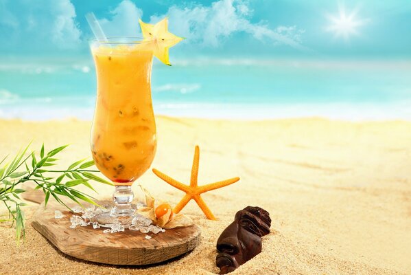 Carambola cocktail on a sandy beach