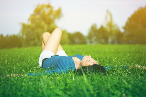 A brunette girl is relaxing in nature