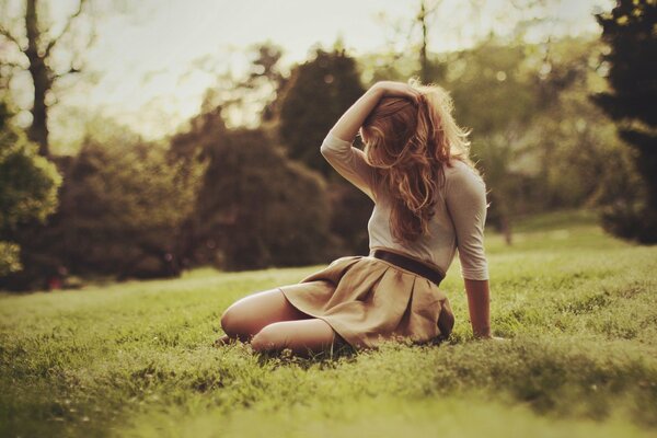 Romantic photo of a girl on the grass