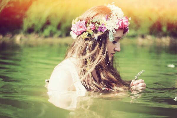 A girl with a wreath of flowers on her head