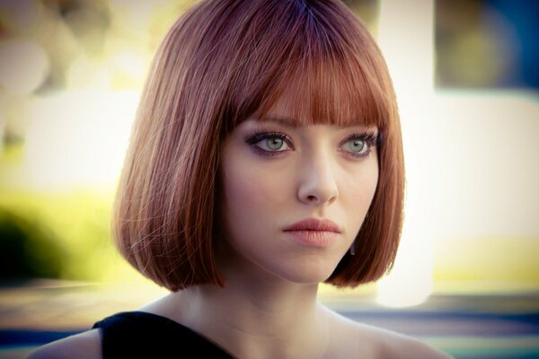 A red-haired girl with a square. Actress Amanda Seyfried