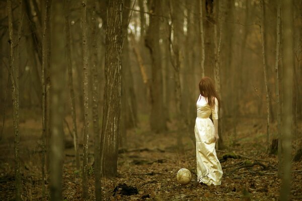 Autumn forest and a girl in white