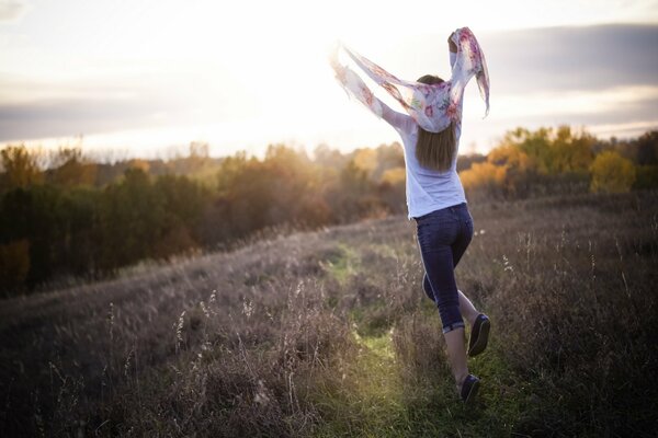 The girl in the field feels free