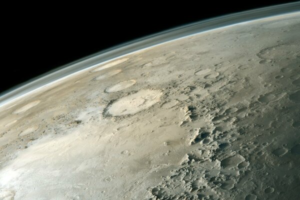 Crater holes on the surface of the planet in space