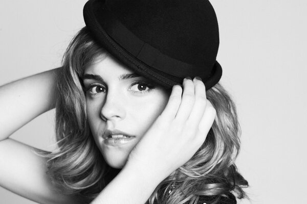 Emma Watson in a hat and wavy hair