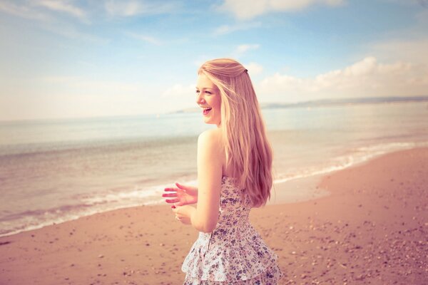 Smiling girl on a sandy beach