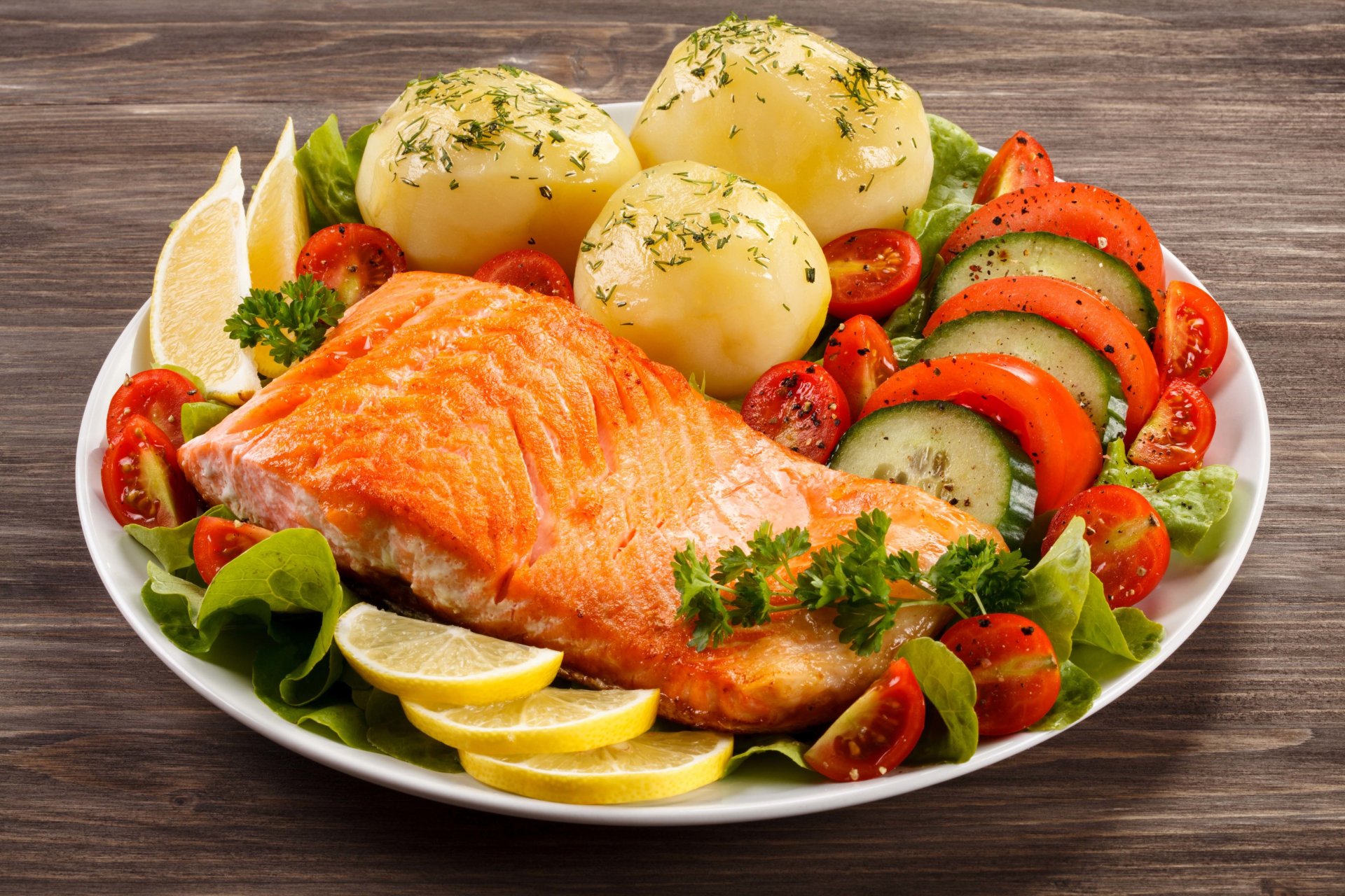 food dish salmon fried fillet potato potato green lettuce butter tomatoes cucumber onion lemon yum-yum gray background wallpaper