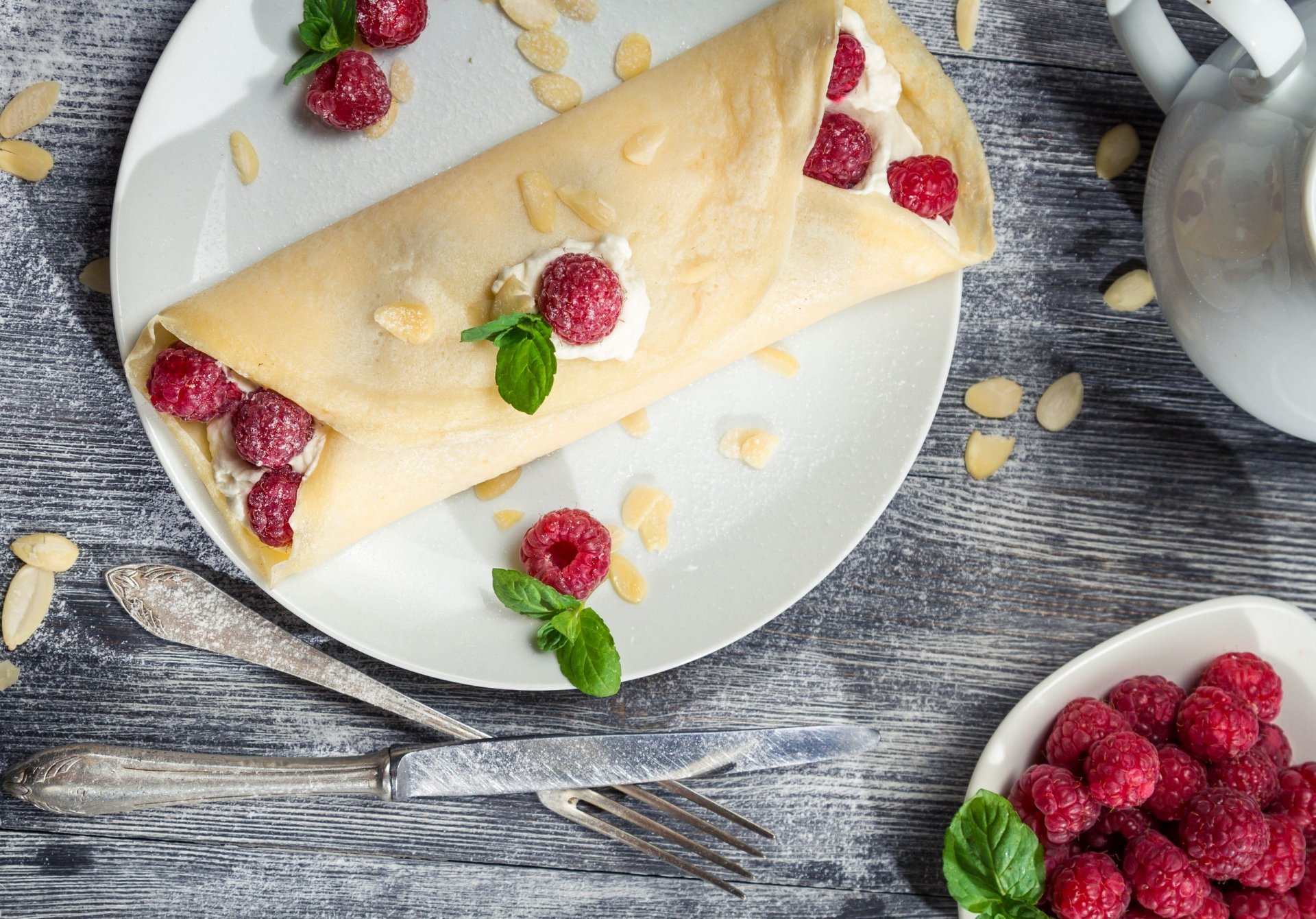 pancake raspberry berries knife fork