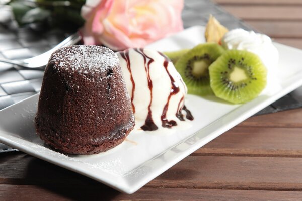 Cake with ice cream and kiwi slices