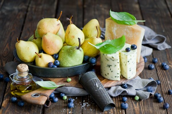 Still life of pears, cheese and berries