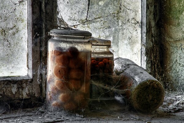 Fruit jars on a dirty window