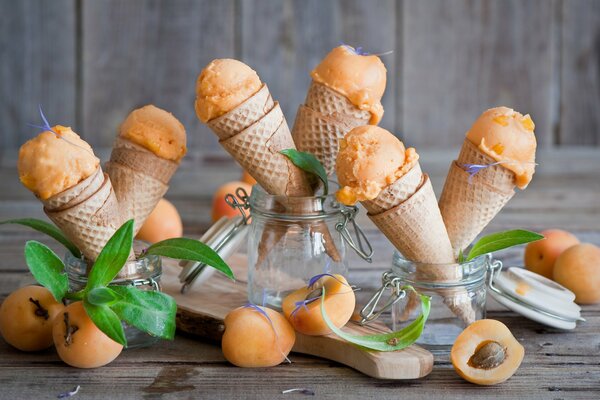 Juicy apricot ice cream in cones