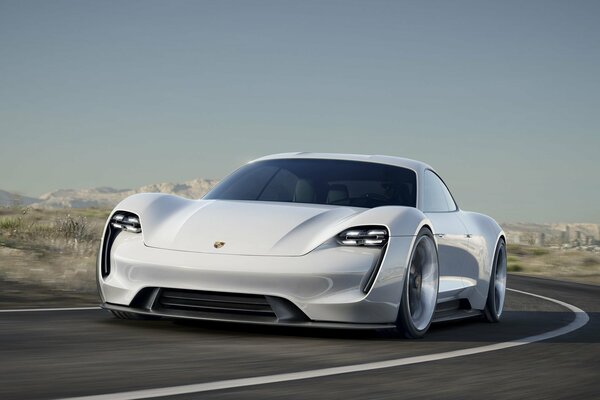 Futuristic Porsche supercar rushes down the road