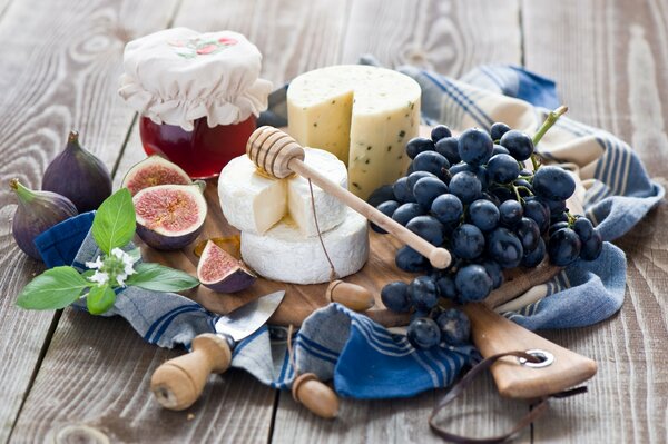 Still life cheese figs and grapes