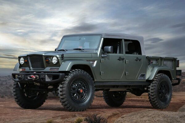 A sturdy jeep in the twilight of the desert