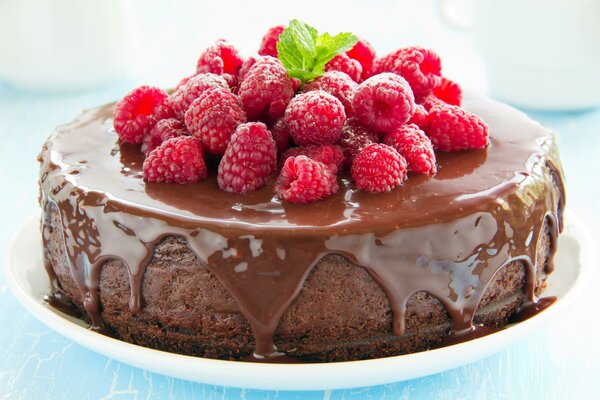 Delicious dessert cake made of berries chocolate and icing