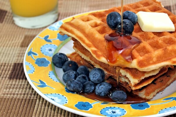 Waffles with blueberries and syrup