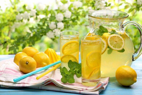 Fresh lemonade with lemon in summer