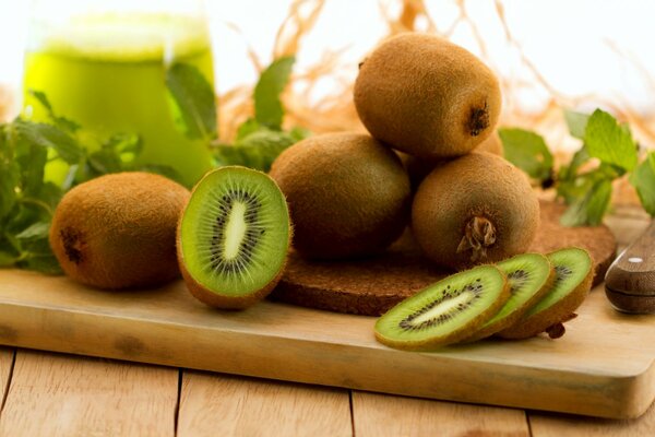 Sliced kiwi on a wooden board