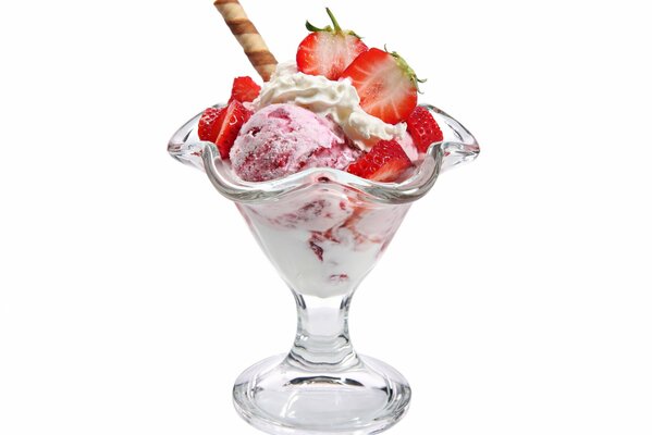 Ice cream with strawberries and a waffle tube in a dessert bowl