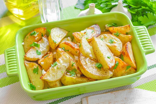 Baked potatoes in a ceramic dish