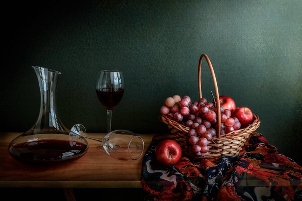 Still life apples and grapes in a basket