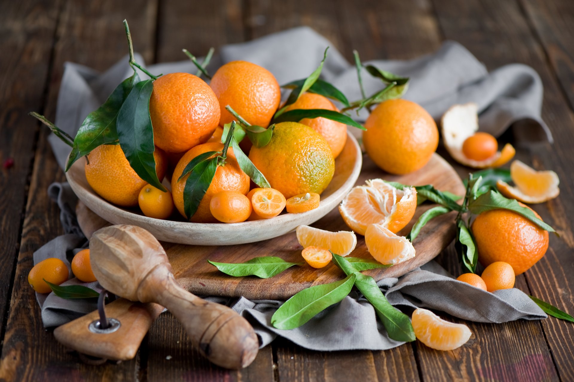 mandarins kumquat fruits orange citrus leaves segments peel dish board still life winter anna verdina