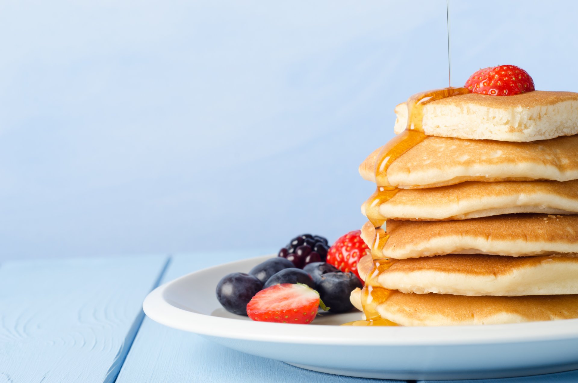 pancakes pancakes pancakes food berries strawberries blueberries blackberries honey plate