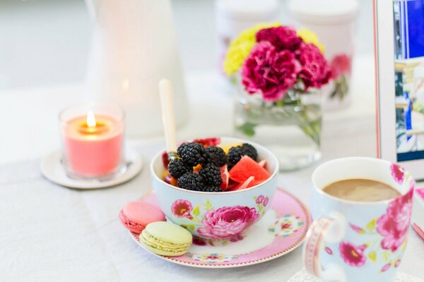 A cup of coffee with berries, fruits and pasta