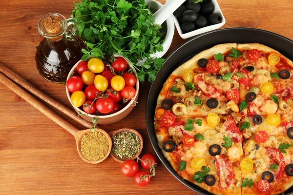 Delicious pizza with cherry tomatoes and olives