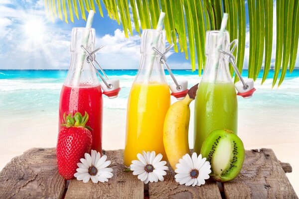 Bright fruit cocktails on the beach