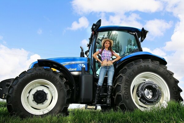 Rustic beauty in a hat on a tractor