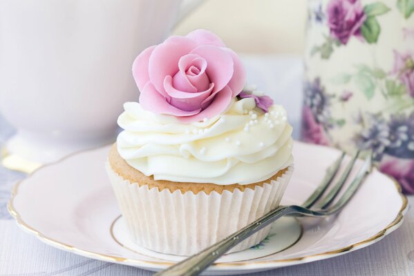 For dessert, a cake with cream and a rose