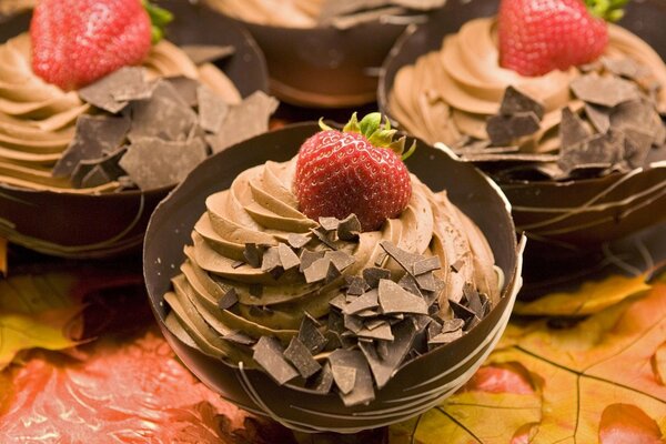 Cakes with berries on autumn leaves