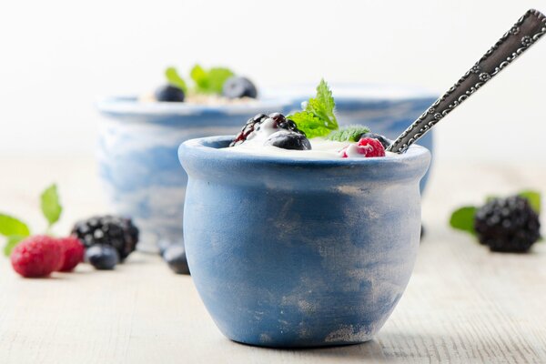 Blackberries, raspberries for dessert with cream