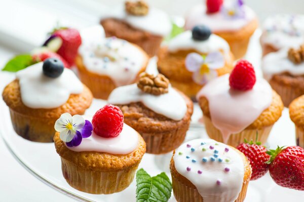 Sweet desserts with strawberries and icing