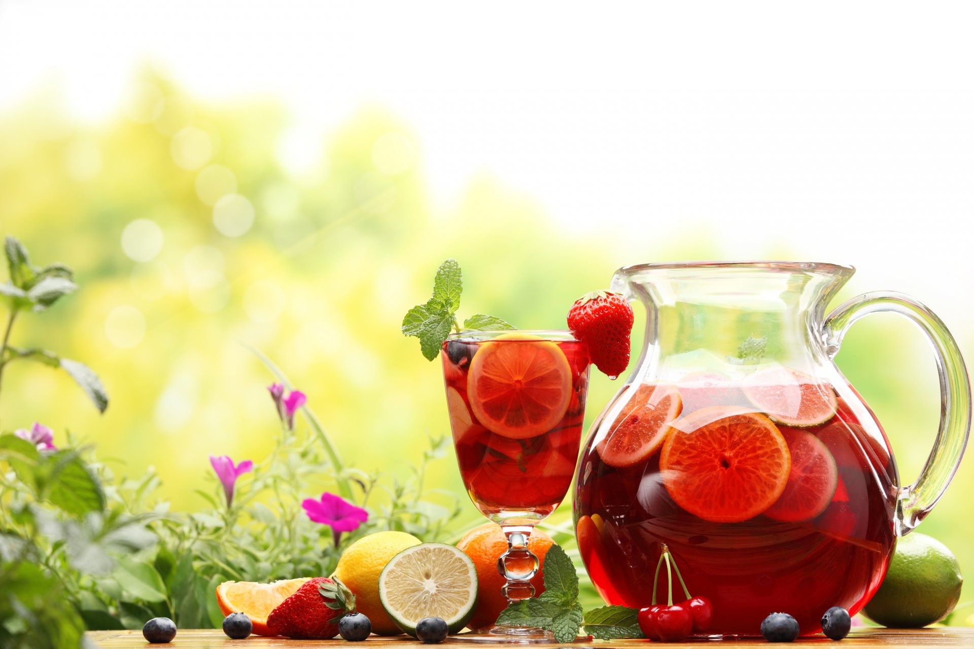 drink compote pitcher carafe fruits berries lemons lima orange strawberry cherry blueberries glass flower nature summer