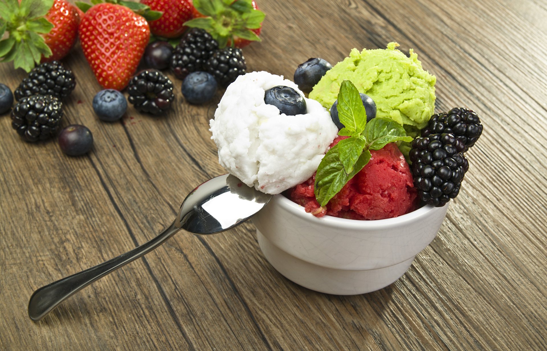 ice cream assorted bulbs spoon berries blueberries blackberry strawberry dessert